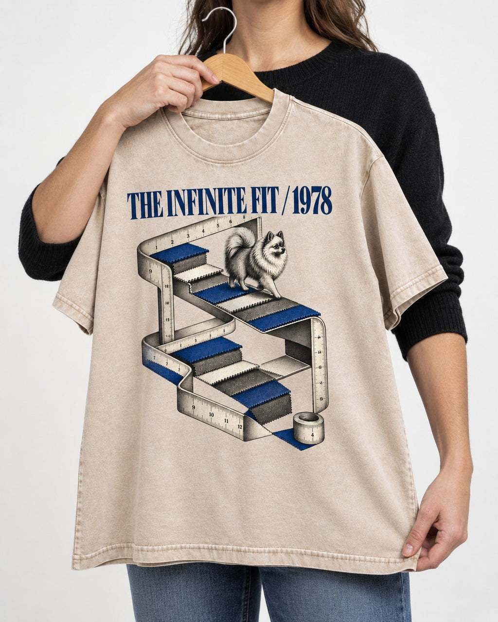 The Infinite Pomeranian Fit Washed Tee in Apricot, held up on a hanger