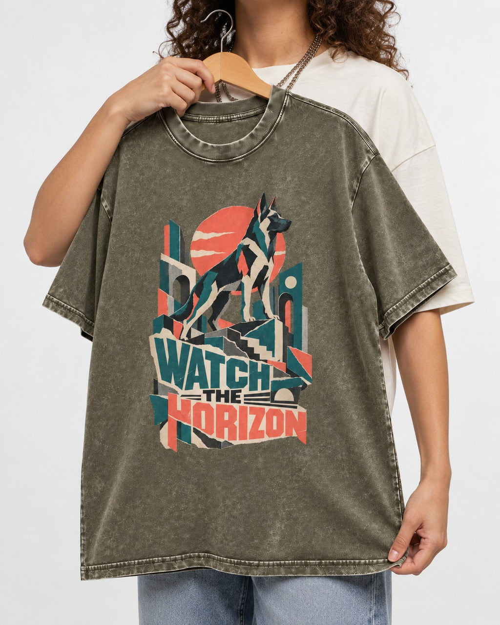 Watch The Horizon Cut Paper Cityscape German Shepherd Dog Graphic Washed Tee in Army Green, held up on a hanger