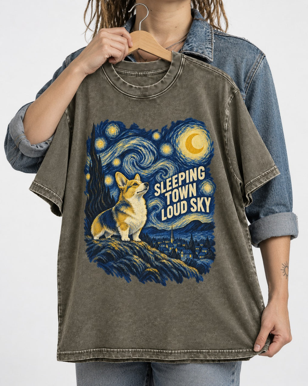 Corgi Sleeping Town Loud Sky Starry Night Washed Tee in Army Green, held up on a hanger