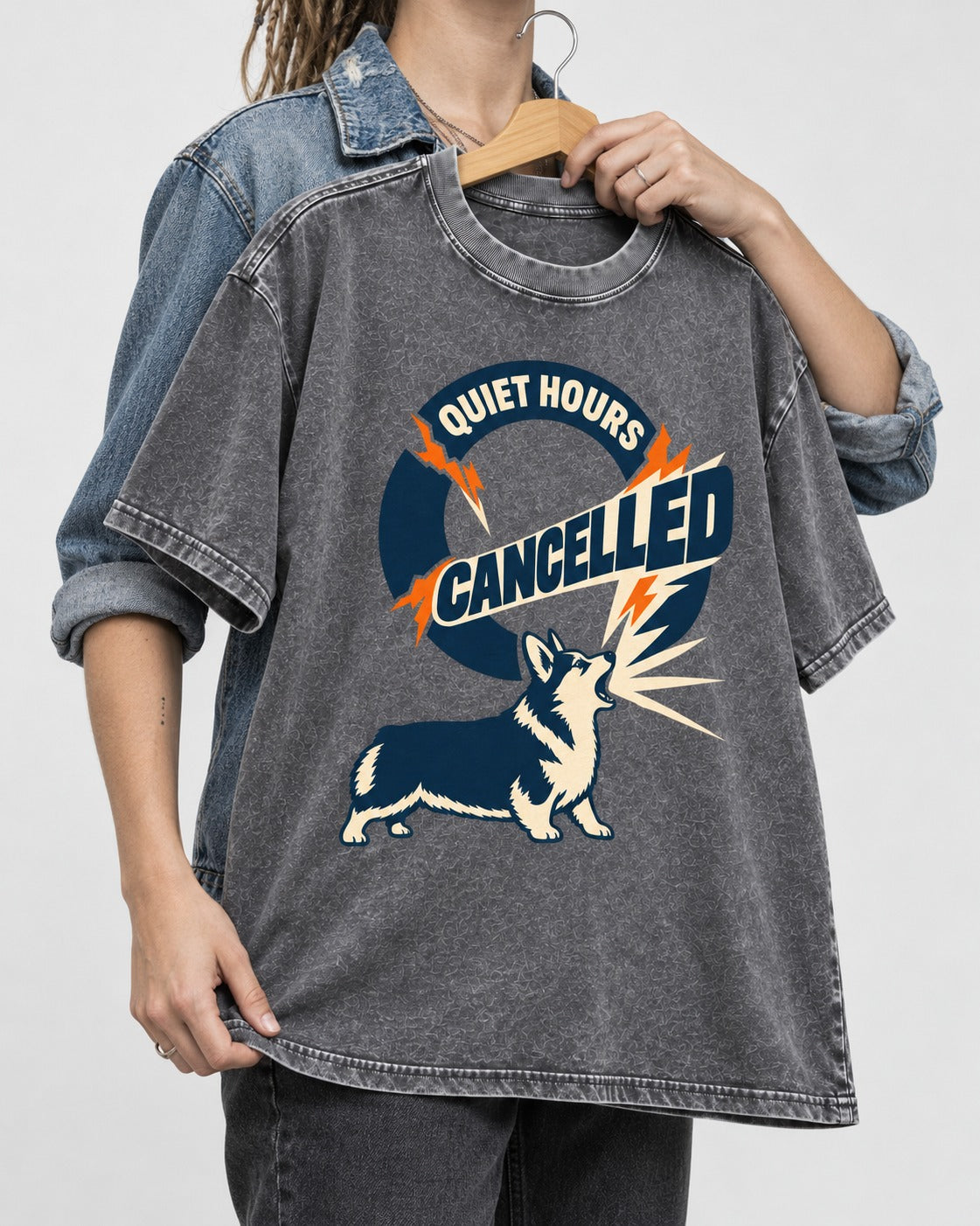 Corgi Quiet Hours Cancelled Calling Badge Graphic Washed Tee in Gray, held up on a hanger