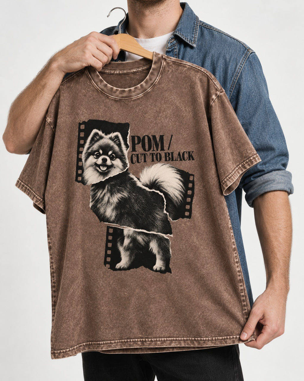 Pomeranian Cut to Black Washed Tee in Coffee, held up on a hanger