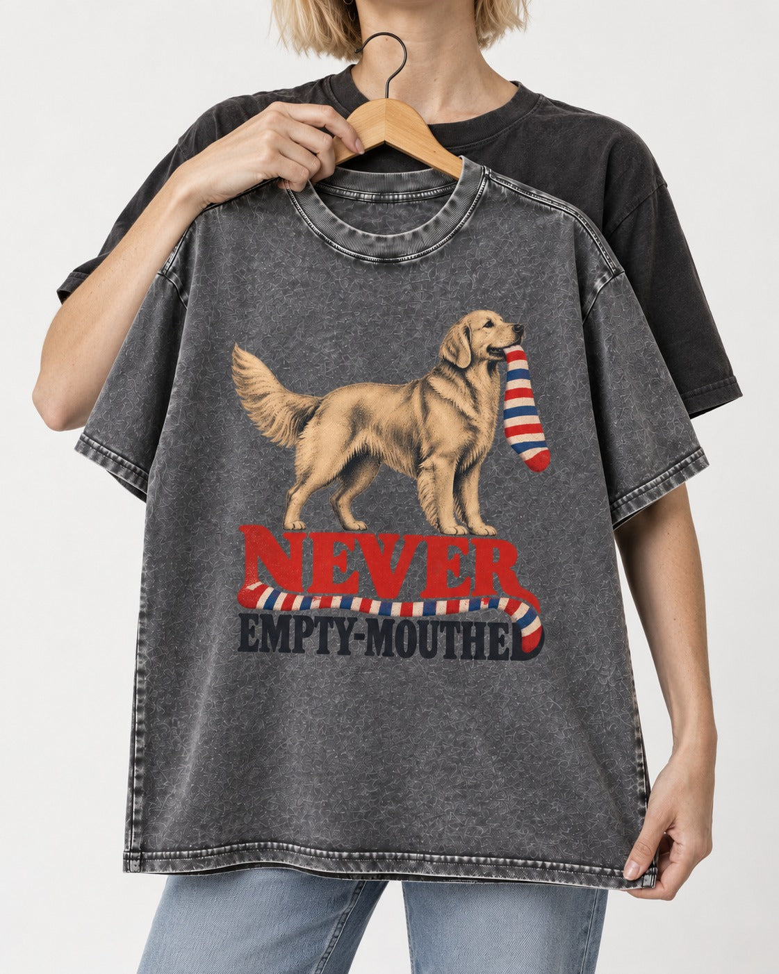 Never Empty Mouthed Golden Retriever Washed Tee in Gray, held up on a hanger