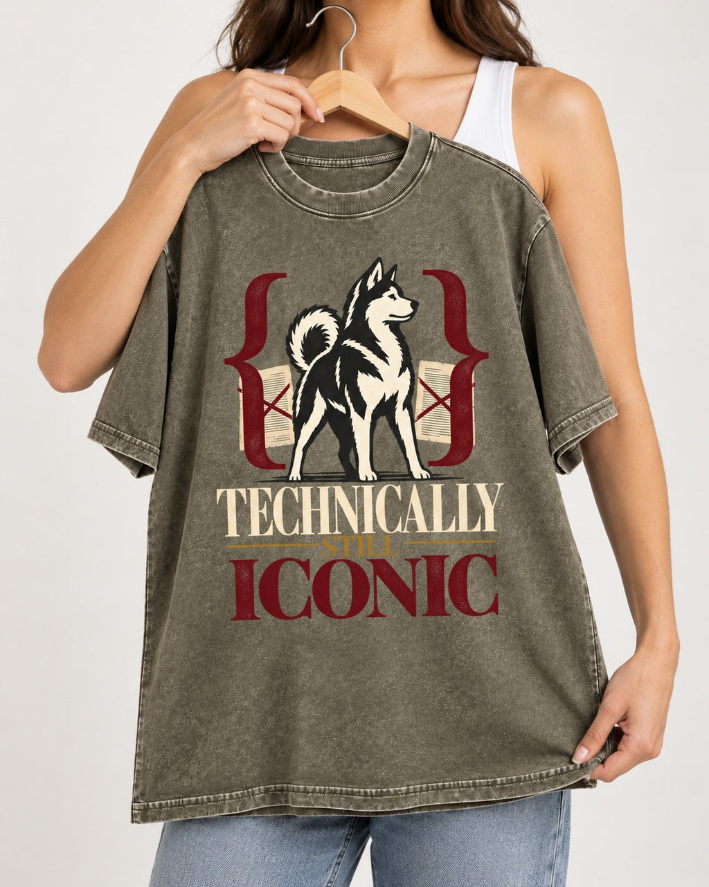 Husky Technically Still Iconic Editorial Frame Graphic Washed Tee in Army Green, held up on a hanger