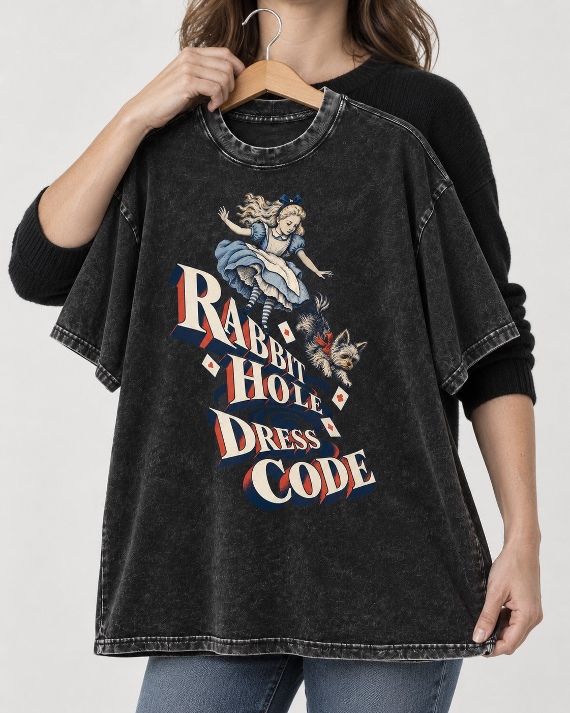 Yorkshire Terrier Rabbit Hole Dress Code Wonderland Graphic Washed Tee in Black, held up on a hanger
