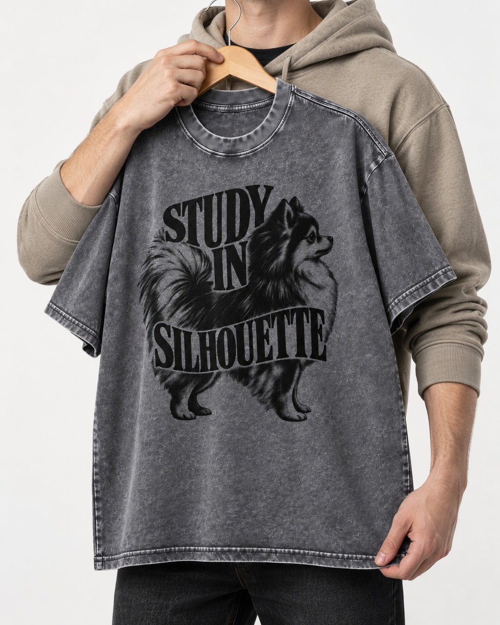 Pomeranian Study in Silhouette Washed Tee in Gray, held up on a hanger