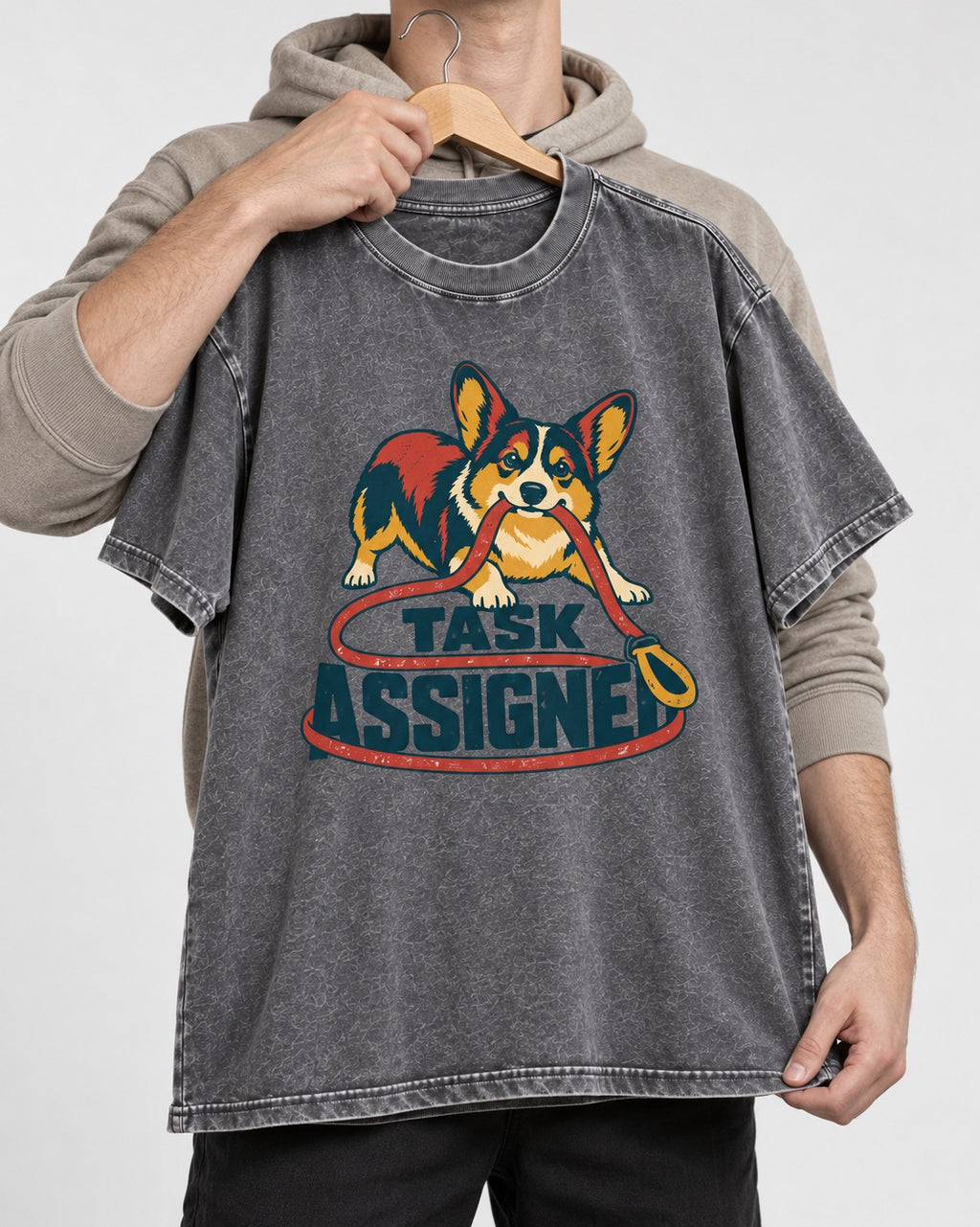 Corgi Task Assigned Washed Tee in Gray, held up on a hanger