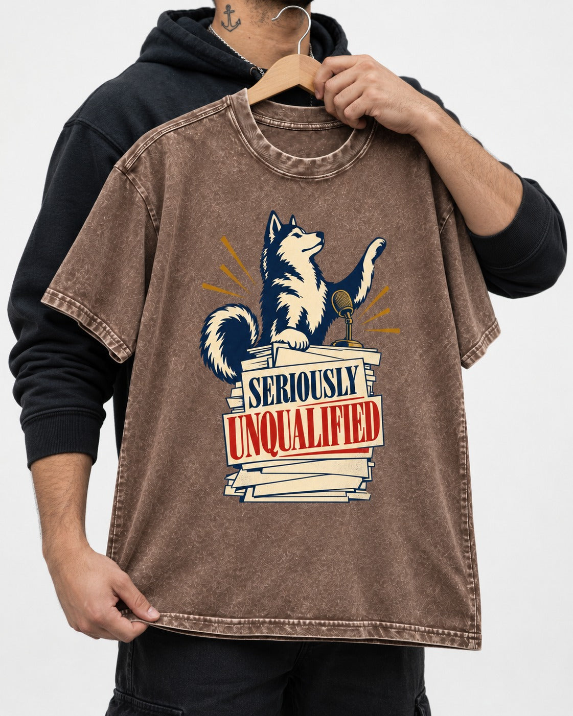 Seriously Unqualified Husky Washed Tee in Coffee, held up on a hanger