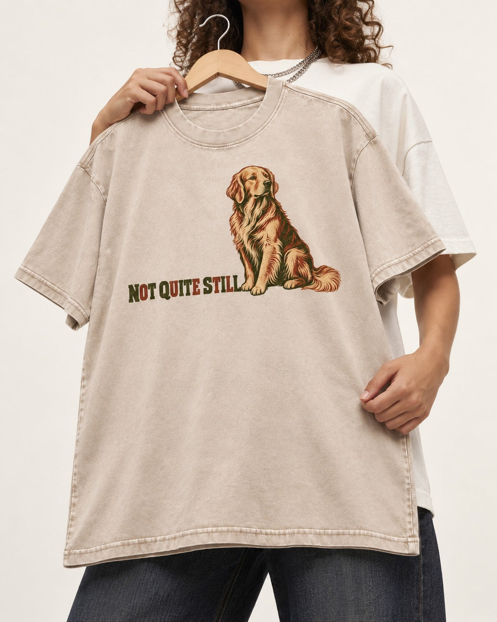 Golden Retriever Not Quite Still Washed Tee in Apricot, held up on a hanger
