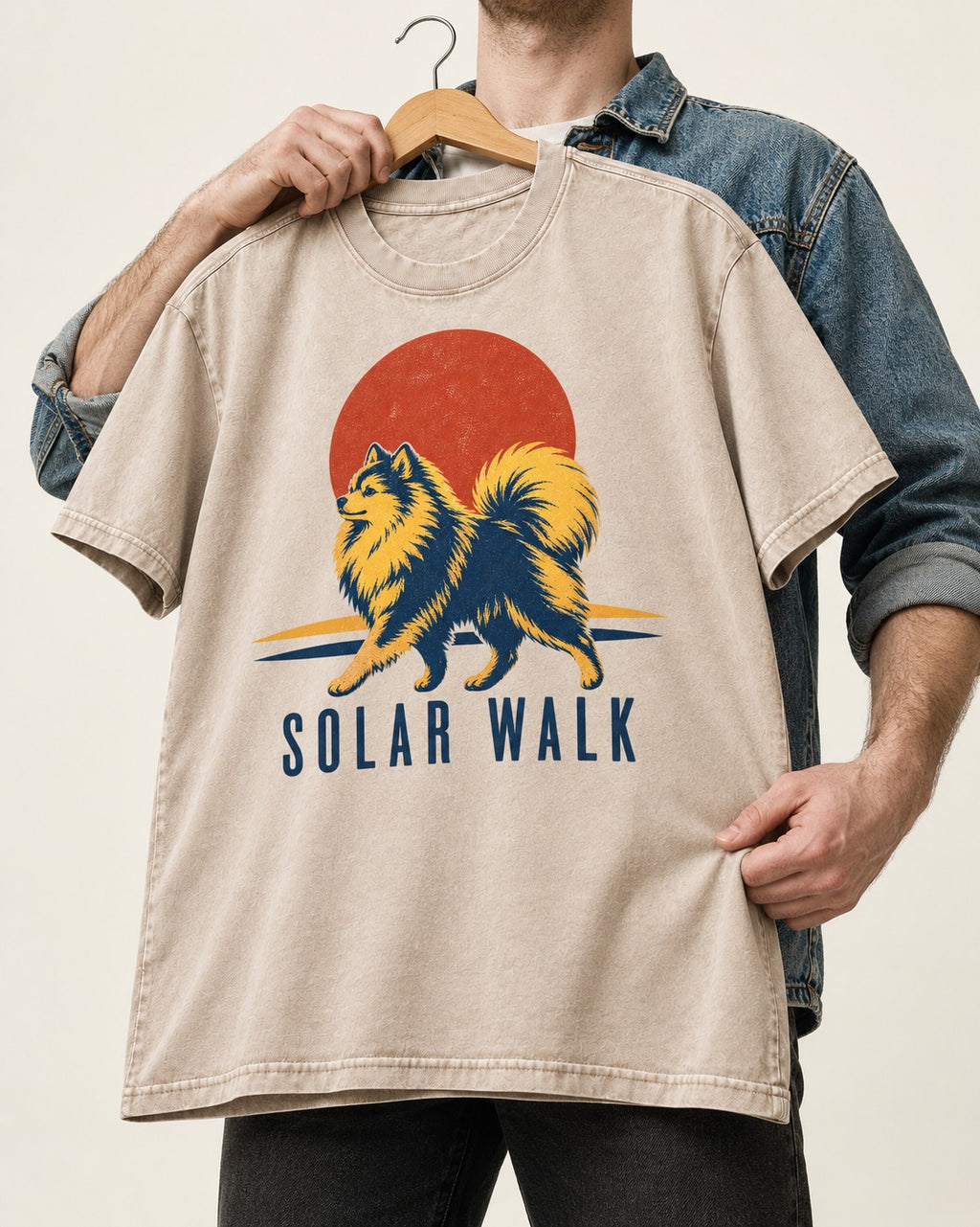 Pomeranian Solar Walk Washed Tee in Apricot, held up on a hanger