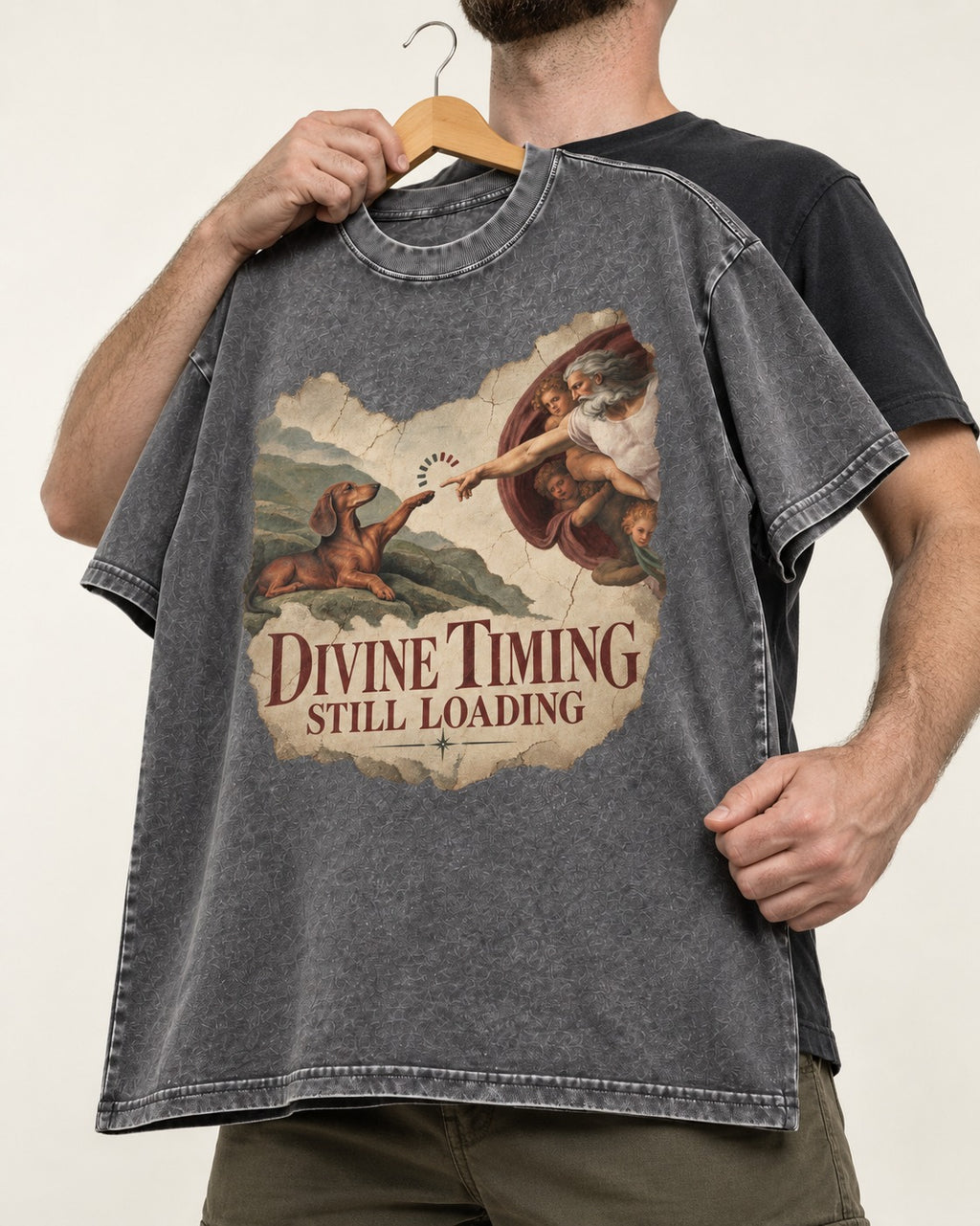 Dachshund's Divine Timing Washed Tee in Gray, held up on a hanger