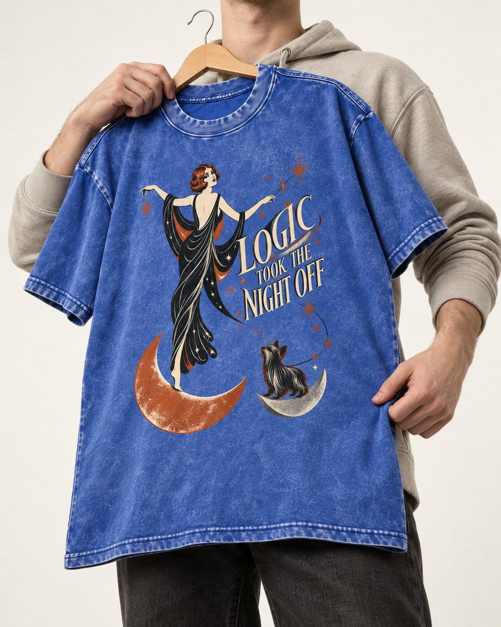 Yorkshire Terrier Logic Took the Night Off Art Deco Graphic Washed Tee in Royal Blue, held up on a hanger