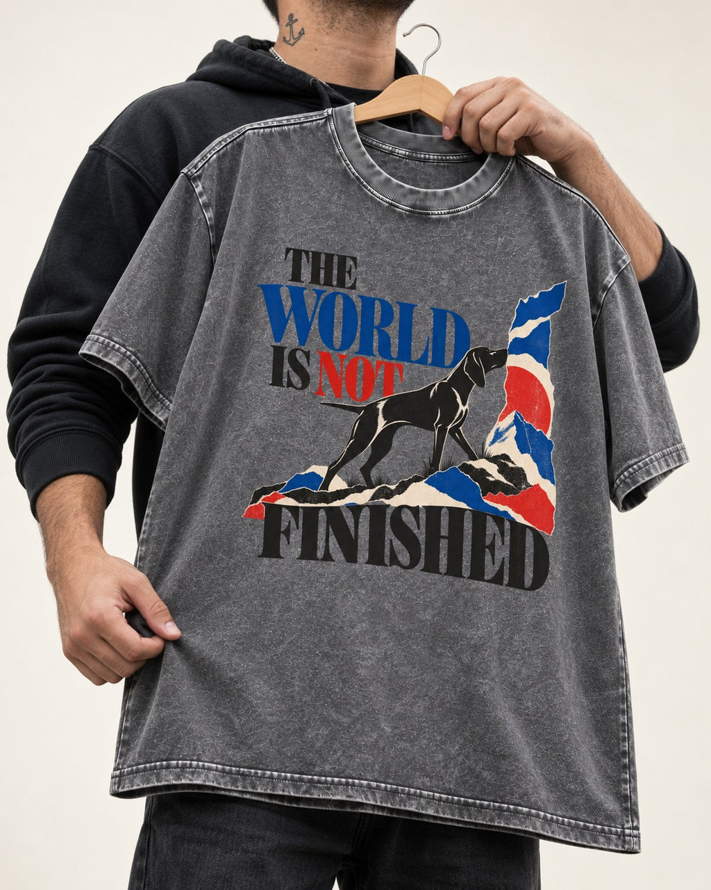World Is Not Finished German Shorthaired Pointer Washed Tee in Gray, held up on a hanger
