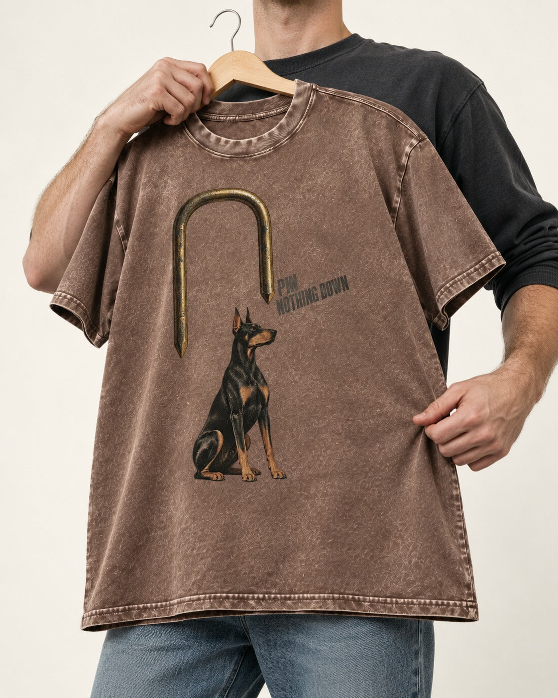 Nothing Pins Doberman Down Washed Tee in Coffee, held up on a hanger