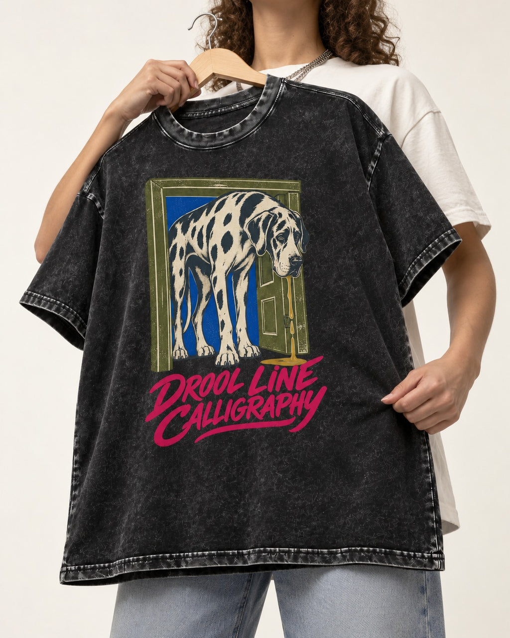 Great Dane Drool Line Calligraphy Doorway Graphic Washed Tee in Black, held up on a hanger