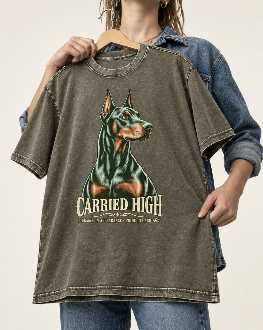Doberman Carried High Portrait Graphic Washed Tee in Army Green, held up on a hanger