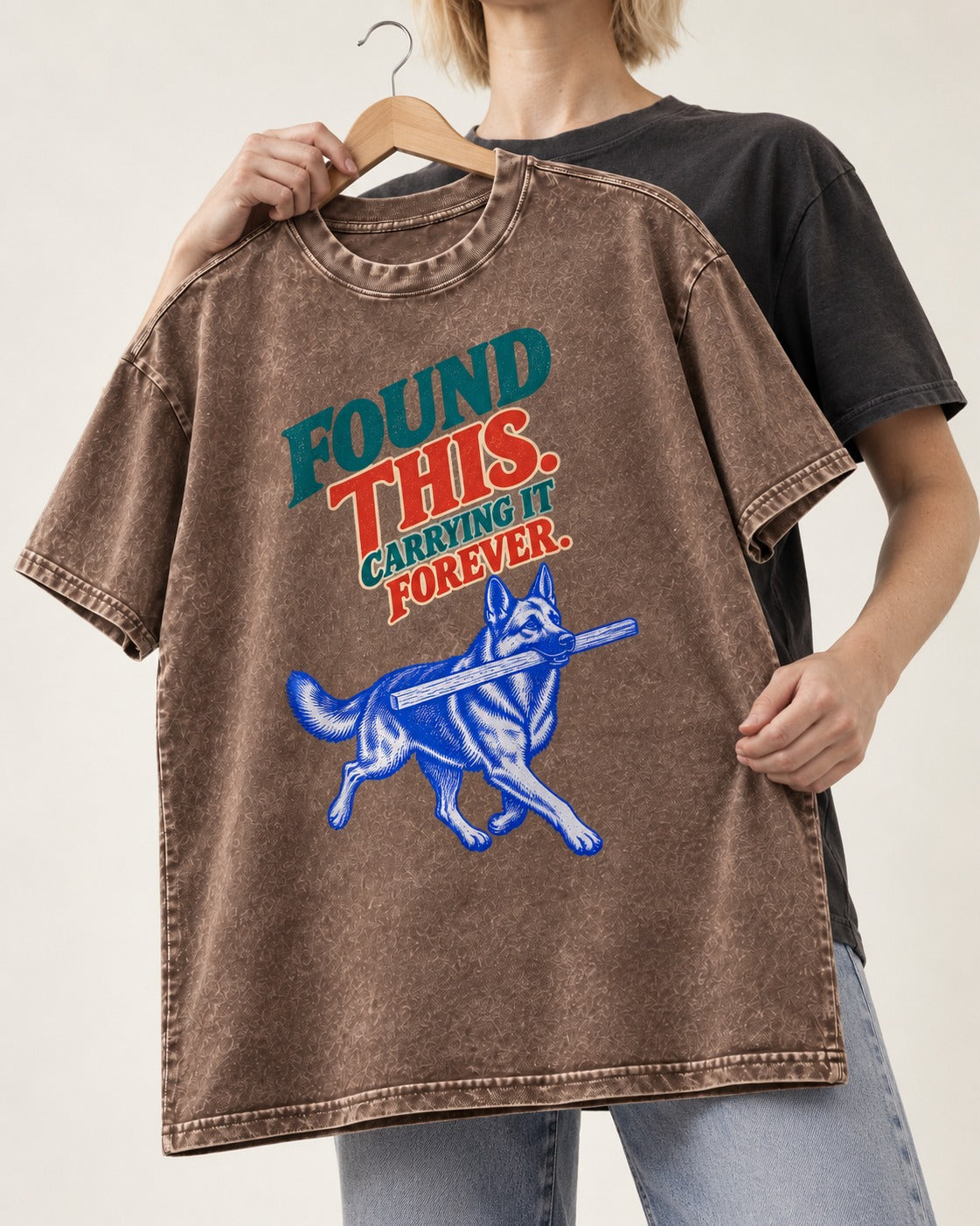 German Shepherd Dog Carrying It Forever Washed Tee in Coffee, held up on a hanger
