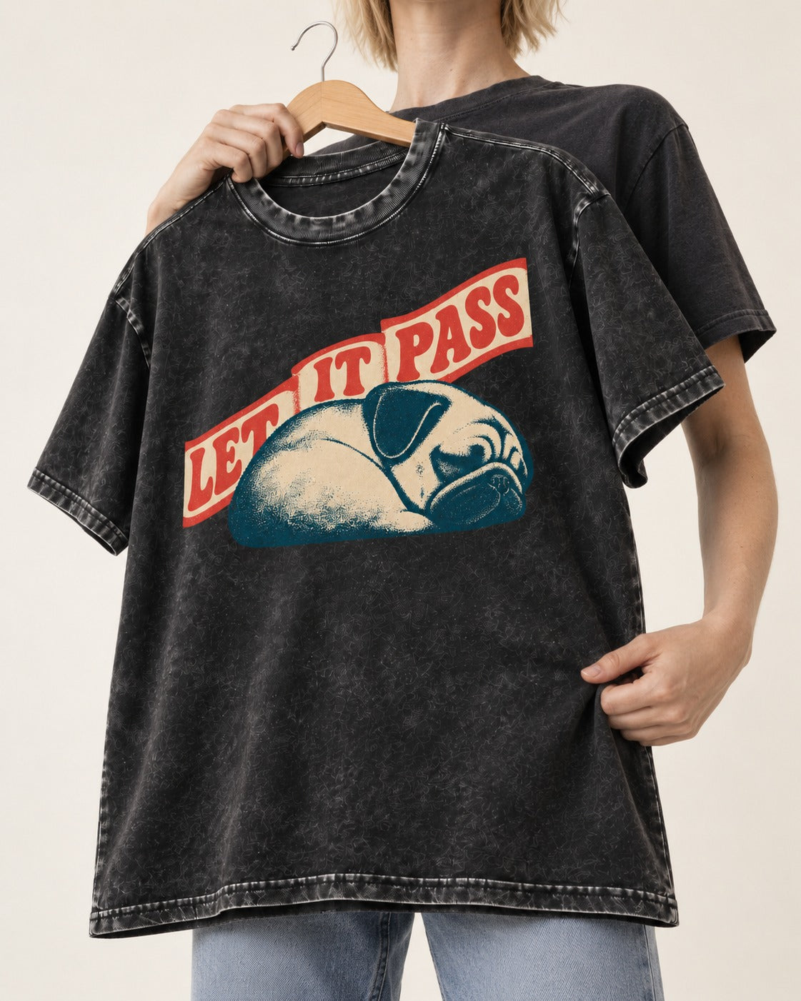 Pug Let It Pass Sleeping Banner Graphic Washed Tee in Black, held up on a hanger