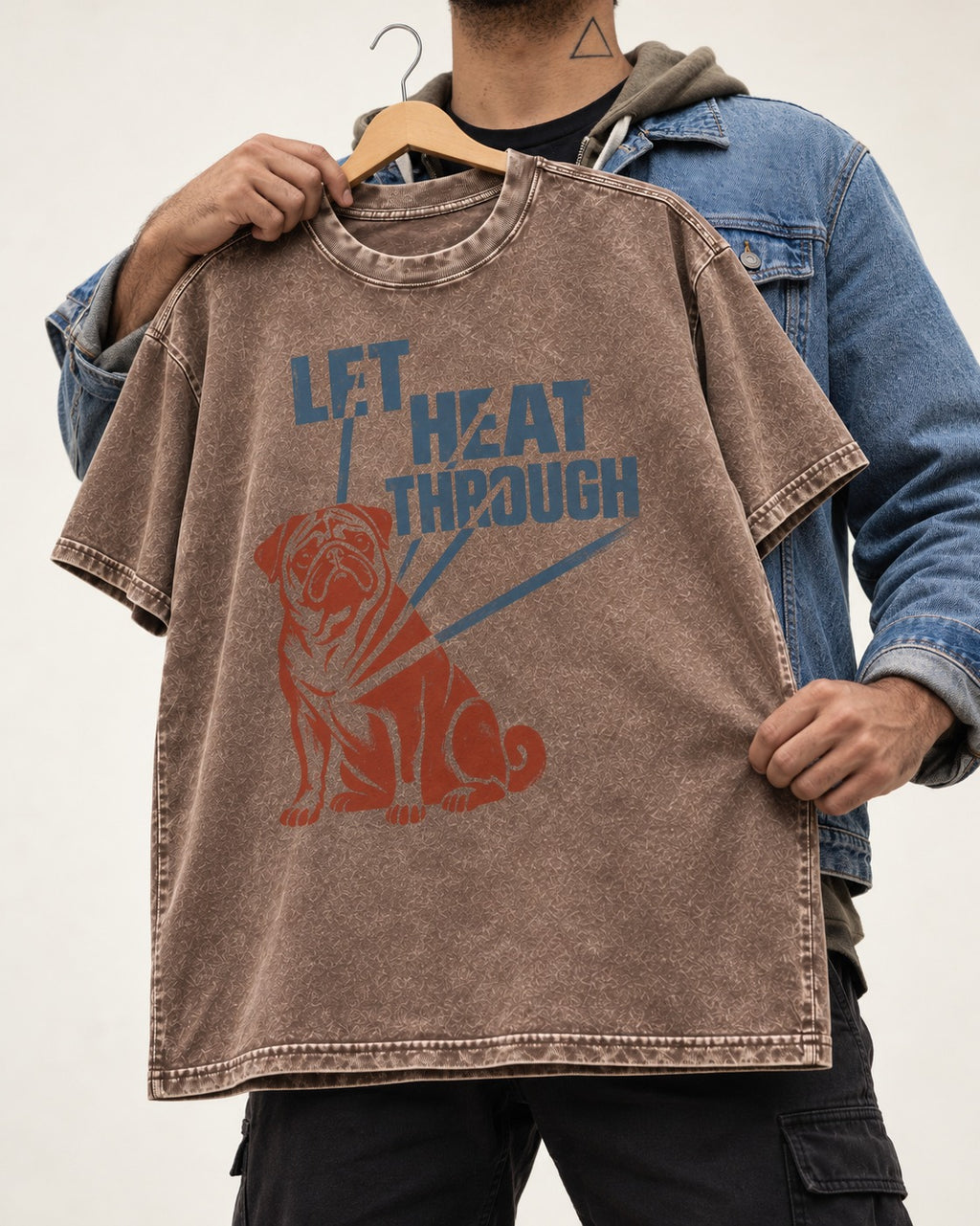 Let the Pug Through Washed Tee in Coffee, held up on a hanger