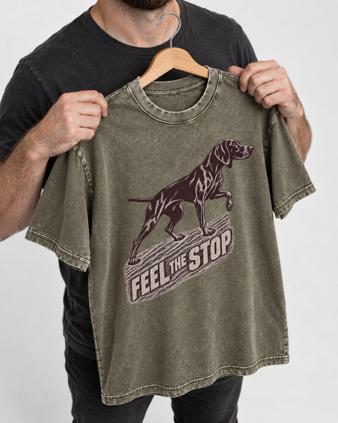German Shorthaired Pointer Feel The Stop Frottage Graphic Washed Tee in Army Green, held up on a hanger
