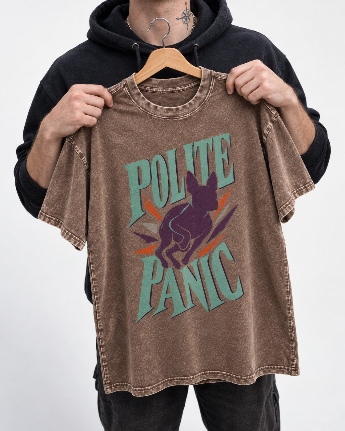 Polite Panic Boston Terrier Washed Tee in Coffee, held up on a hanger