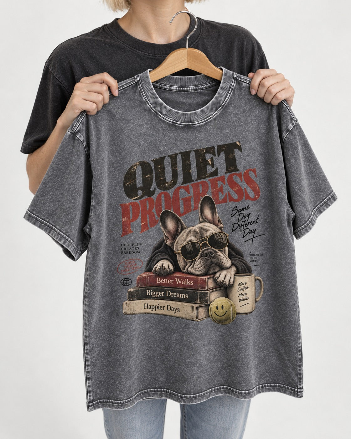 Quiet Progress Frenchie Washed Tee in Gray, held up on a hanger