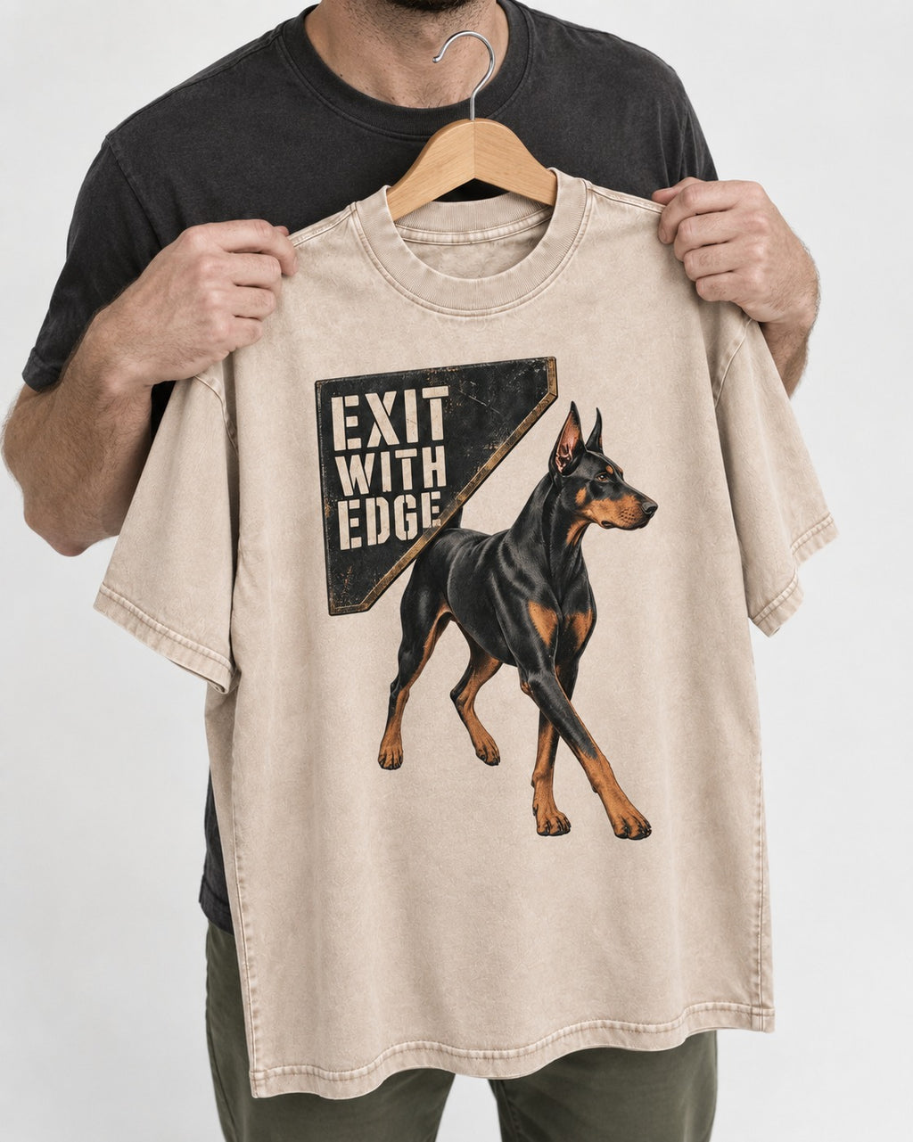 Exit with Doberman Edge Washed Tee in Apricot, held up on a hanger