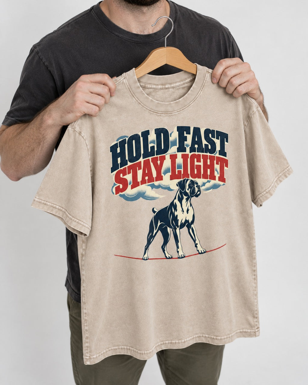 Hold Fast Stay Light Boxer Cloud Graphic Washed Tee in Apricot, held up on a hanger