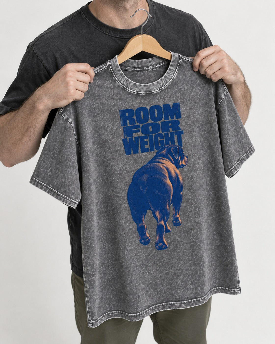 Room for Weight Rottweiler Washed Tee in Gray, held up on a hanger