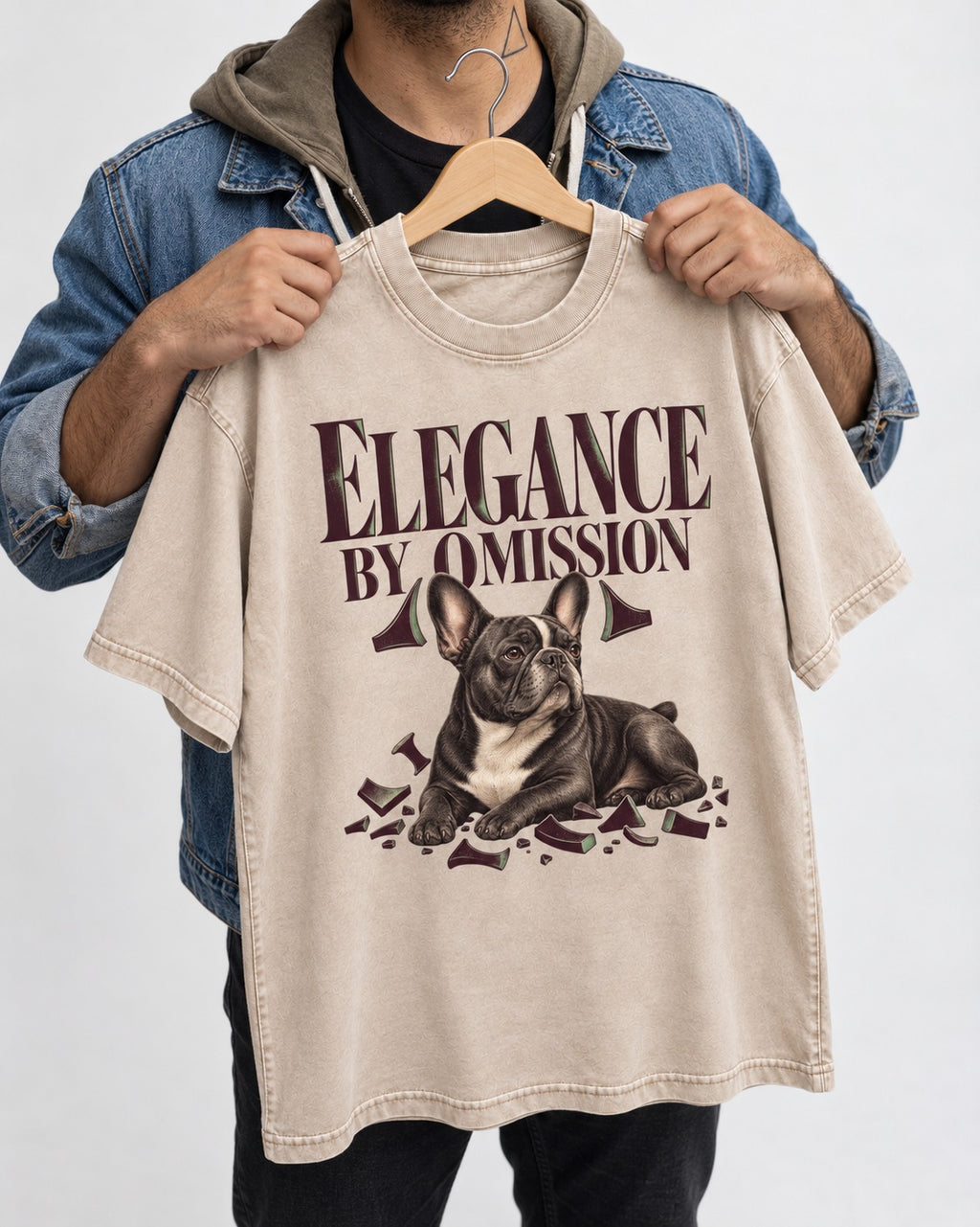 Frenchie Elegance by Omission Washed Tee in Apricot, held up on a hanger