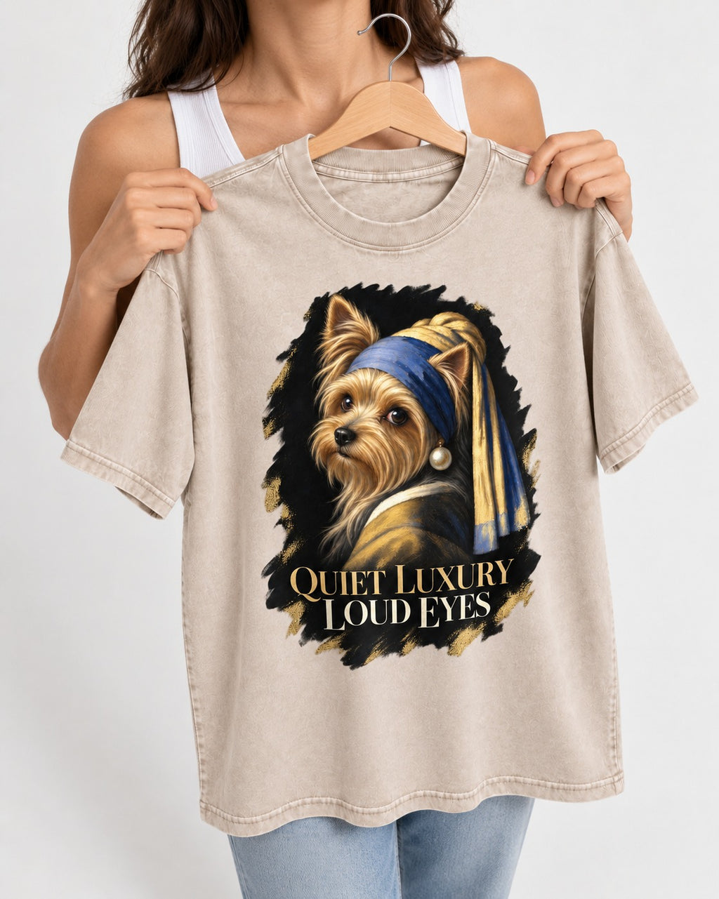 Yorkshire Terrier Quiet Luxury Loud Eyes Pearl Portrait Graphic Washed Tee in Apricot, held up on a hanger