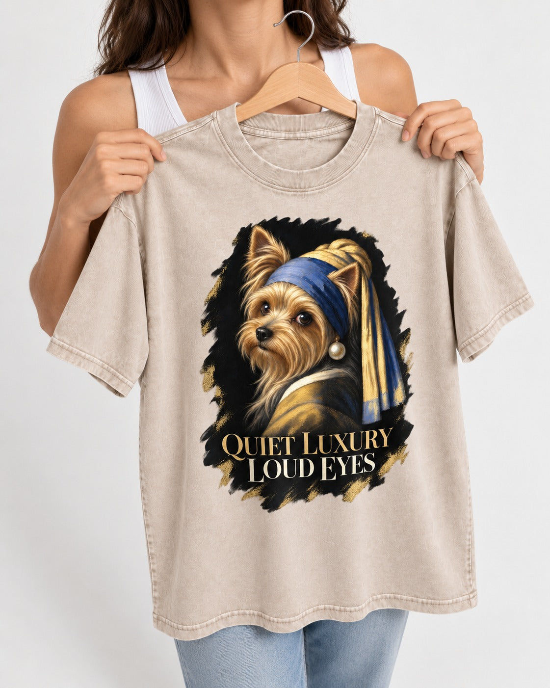 Yorkshire Terrier Quiet Luxury Loud Eyes Pearl Portrait Graphic Washed Tee in Apricot, held up on a hanger