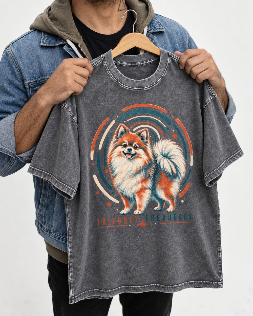 Friendly Frequency Pomeranian Washed Tee in Gray, held up on a hanger