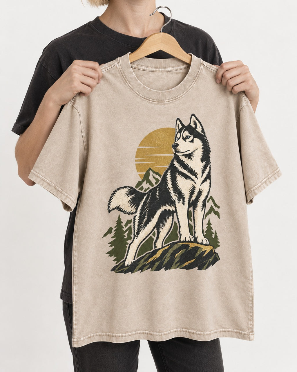Husky Born to Roam Washed Tee in Apricot, held up on a hanger