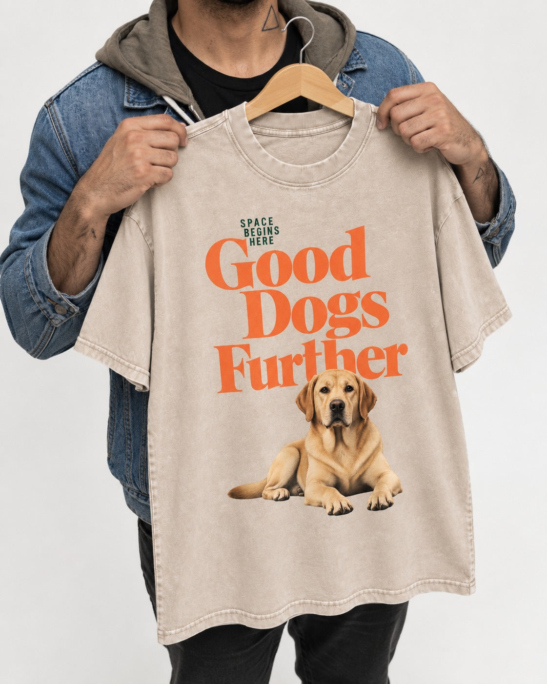 Good Labrador Retriever Goes Further Washed Tee in Apricot, held up on a hanger