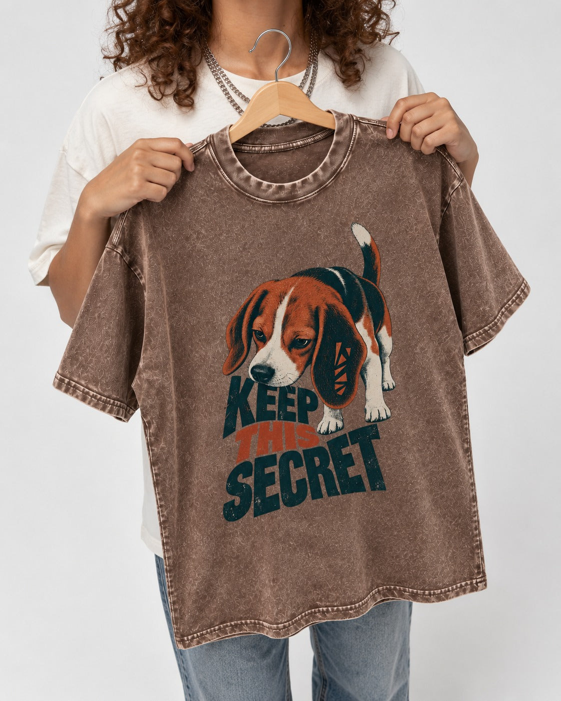 Beagle Keep This Secret Washed Tee in Coffee, held up on a hanger