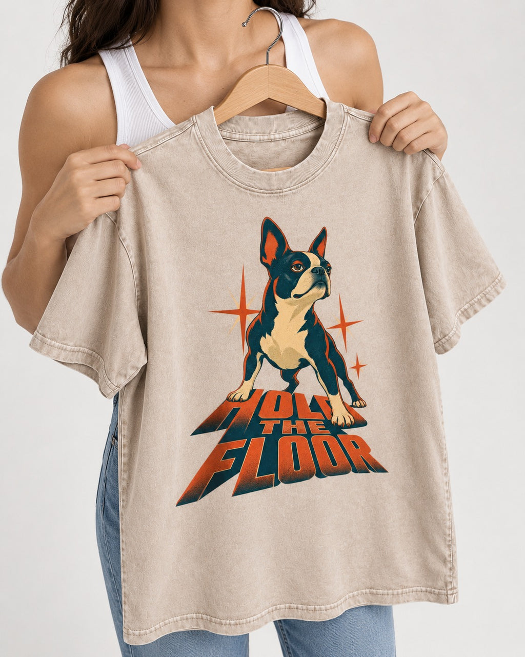 Boston Terrier On The Floor Perspective Graphic Washed Tee in Apricot, held up on a hanger