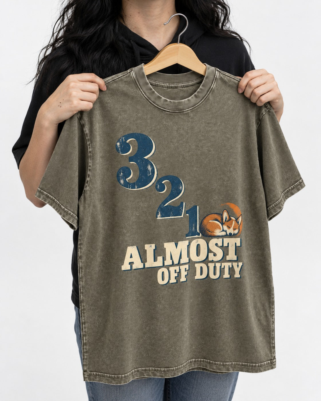 Corgi Almost Off Duty Washed Tee in Army Green, held up on a hanger