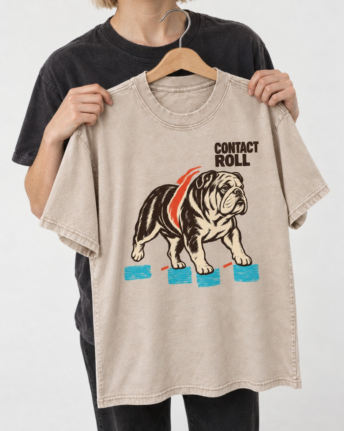 Contact Roll English Bulldog Washed Tee in Apricot, held up on a hanger