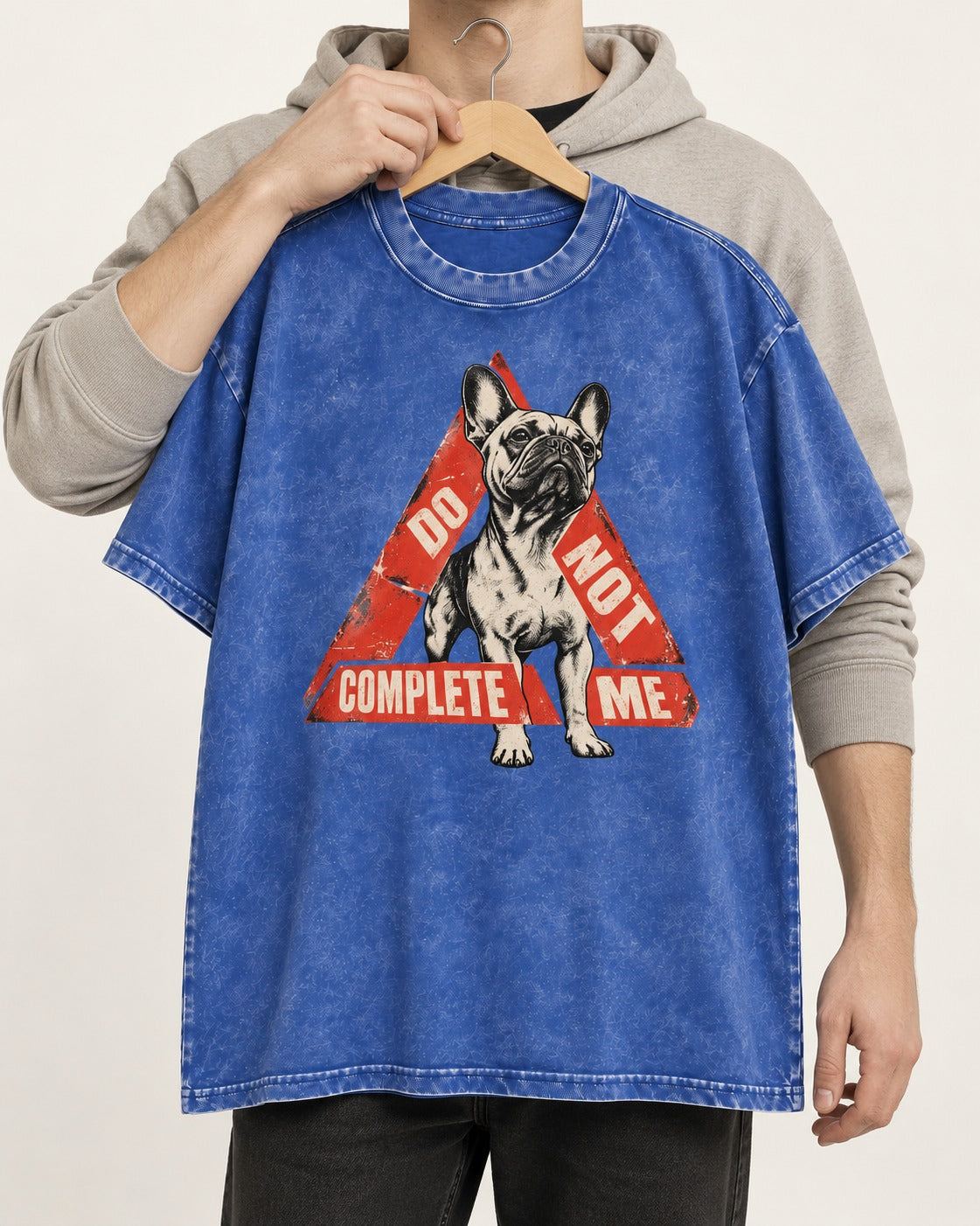 Frenchie Do Not Complete Me Warning Triangle Graphic Washed Tee in Royal Blue, held up on a hanger