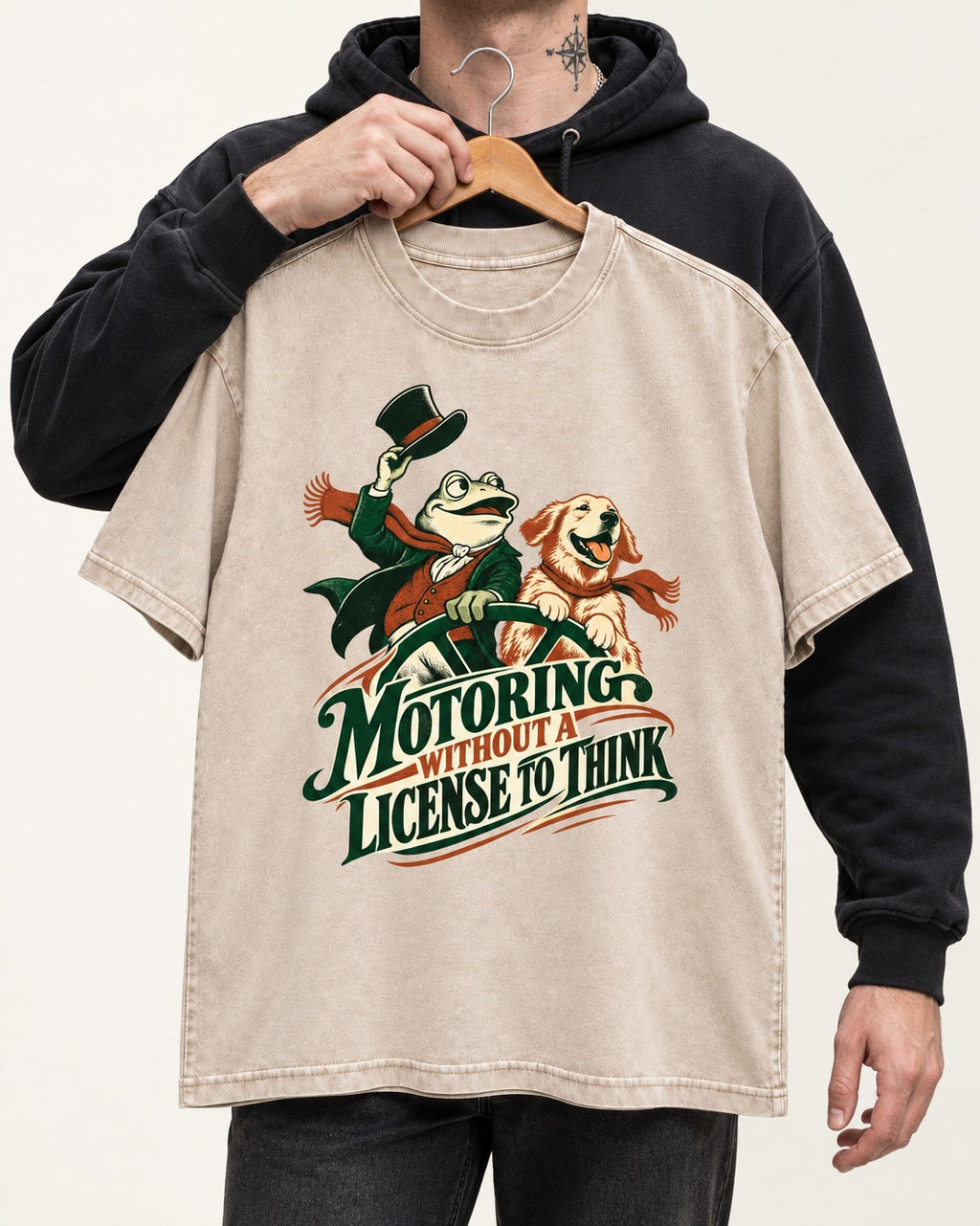 Golden Retriever Motoring Without a License to Think Driving Graphic Washed Tee in Apricot, held up on a hanger