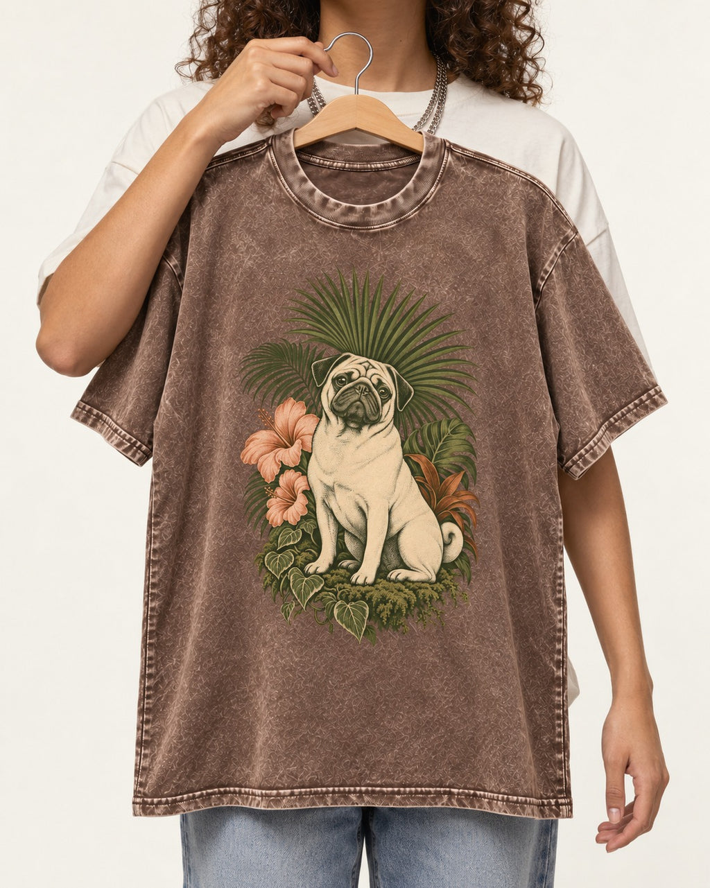 Pug Paradise Washed Tee in Coffee, held up on a hanger