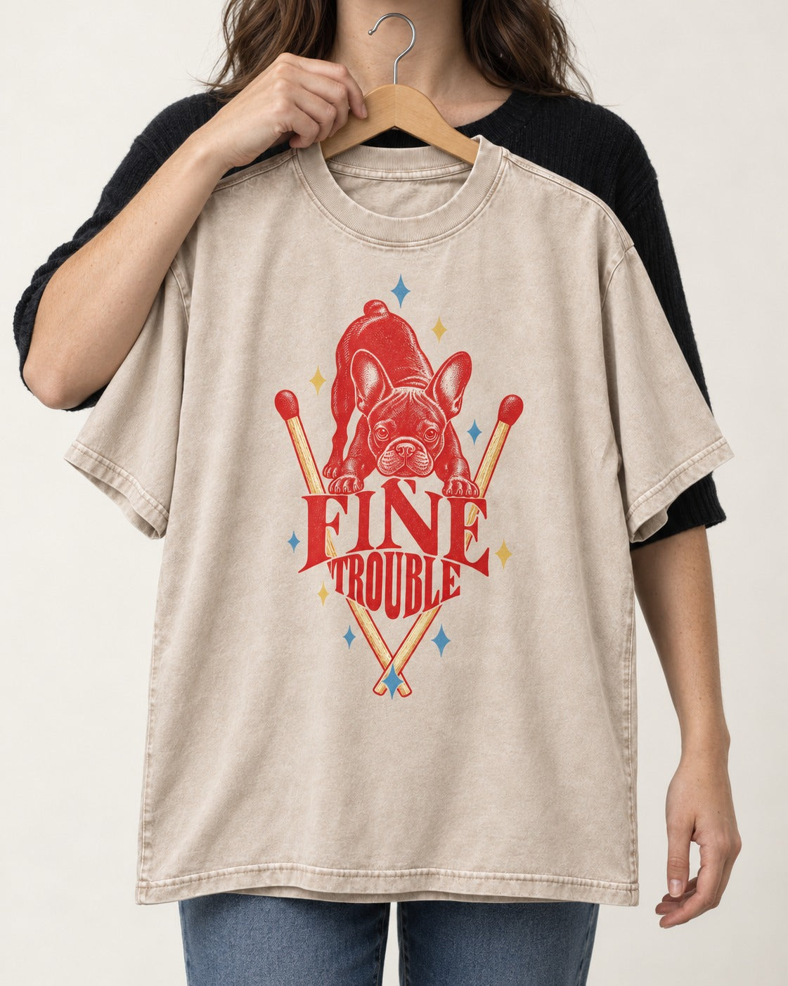 Fine Trouble Boston Terrier Matchstick Graphic Washed Tee in Apricot, held up on a hanger