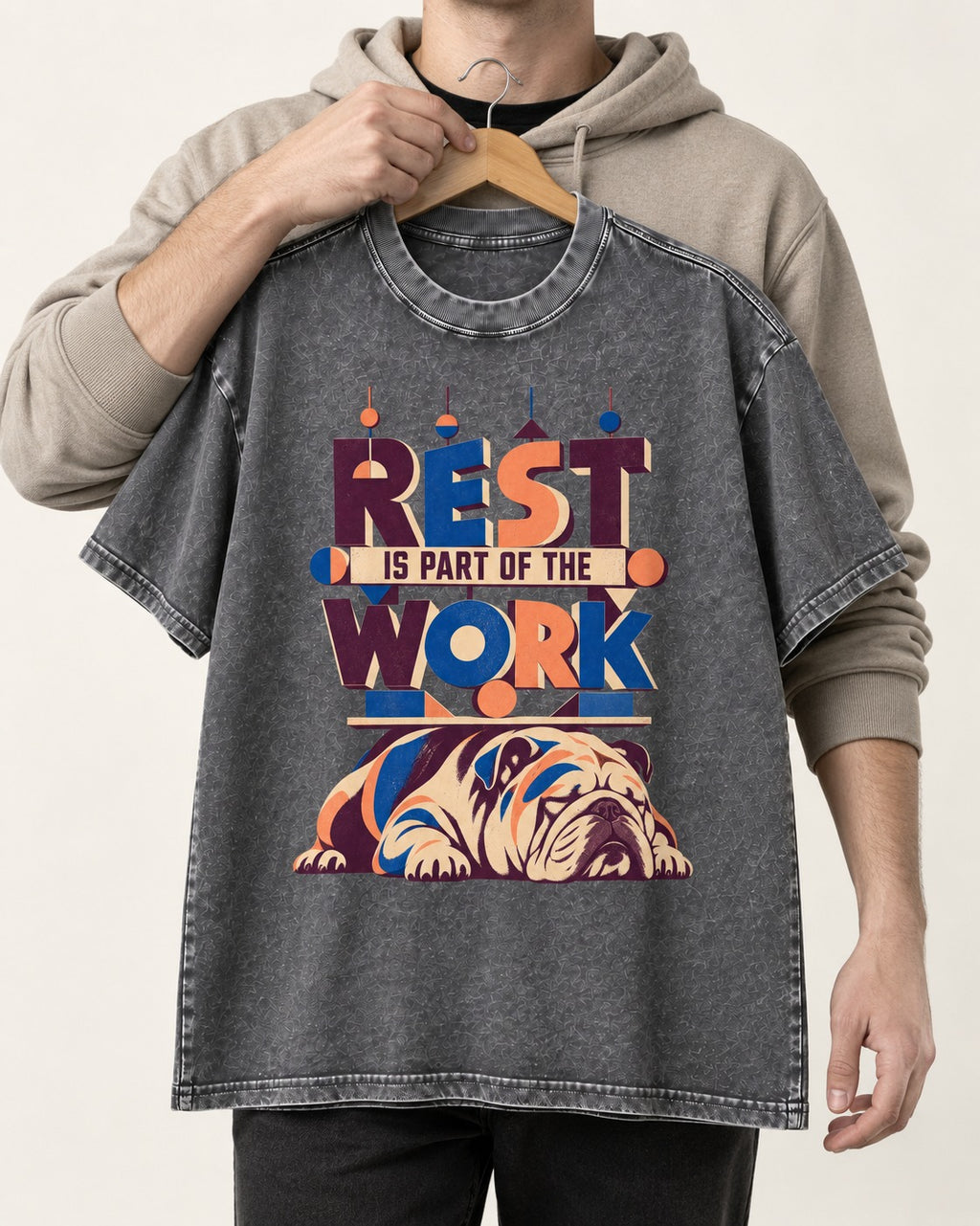 Rest Is Work English Bulldog Washed Tee in Gray, held up on a hanger