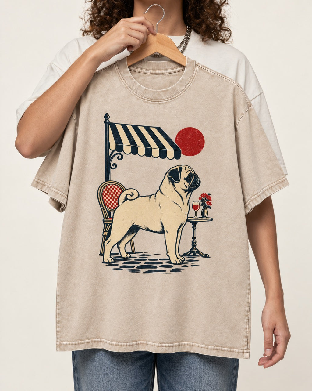 Pug Joie De Vivre Washed Tee in Apricot, held up on a hanger