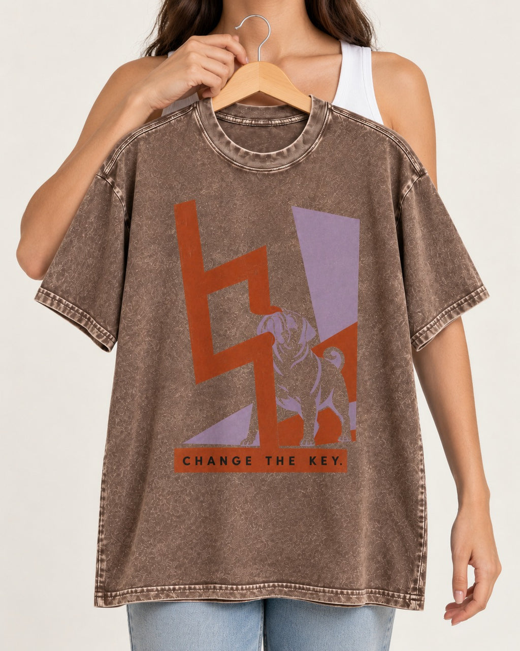 Pug Change the Key Washed Tee in Coffee, held up on a hanger