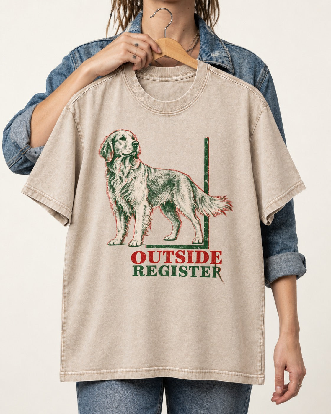 Outside Register Golden Retriever Washed Tee in Apricot, held up on a hanger