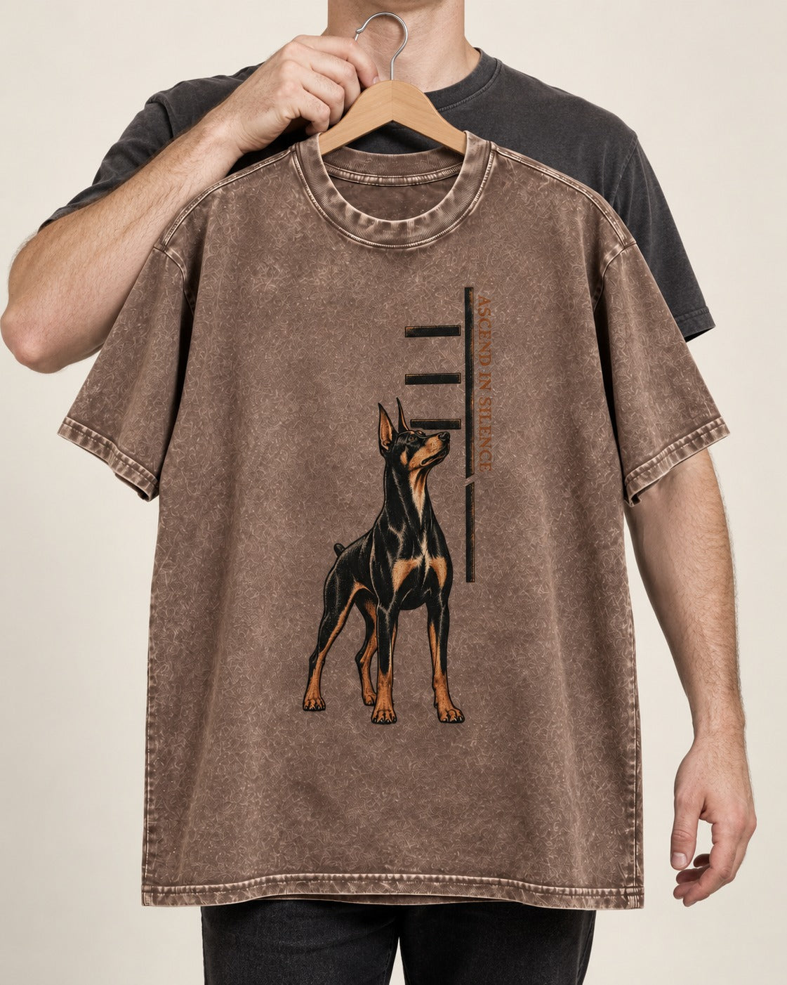 Doberman Ascend in Silence Washed Tee in Coffee, held up on a hanger