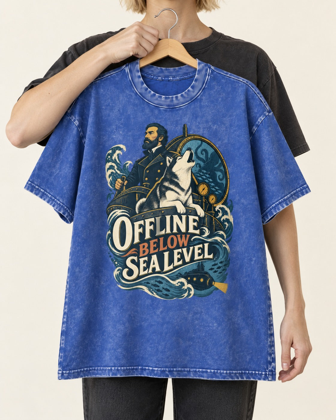 Husky Offline Below Sea Level Nautical Submarine Graphic Washed Tee in Royal Blue, held up on a hanger