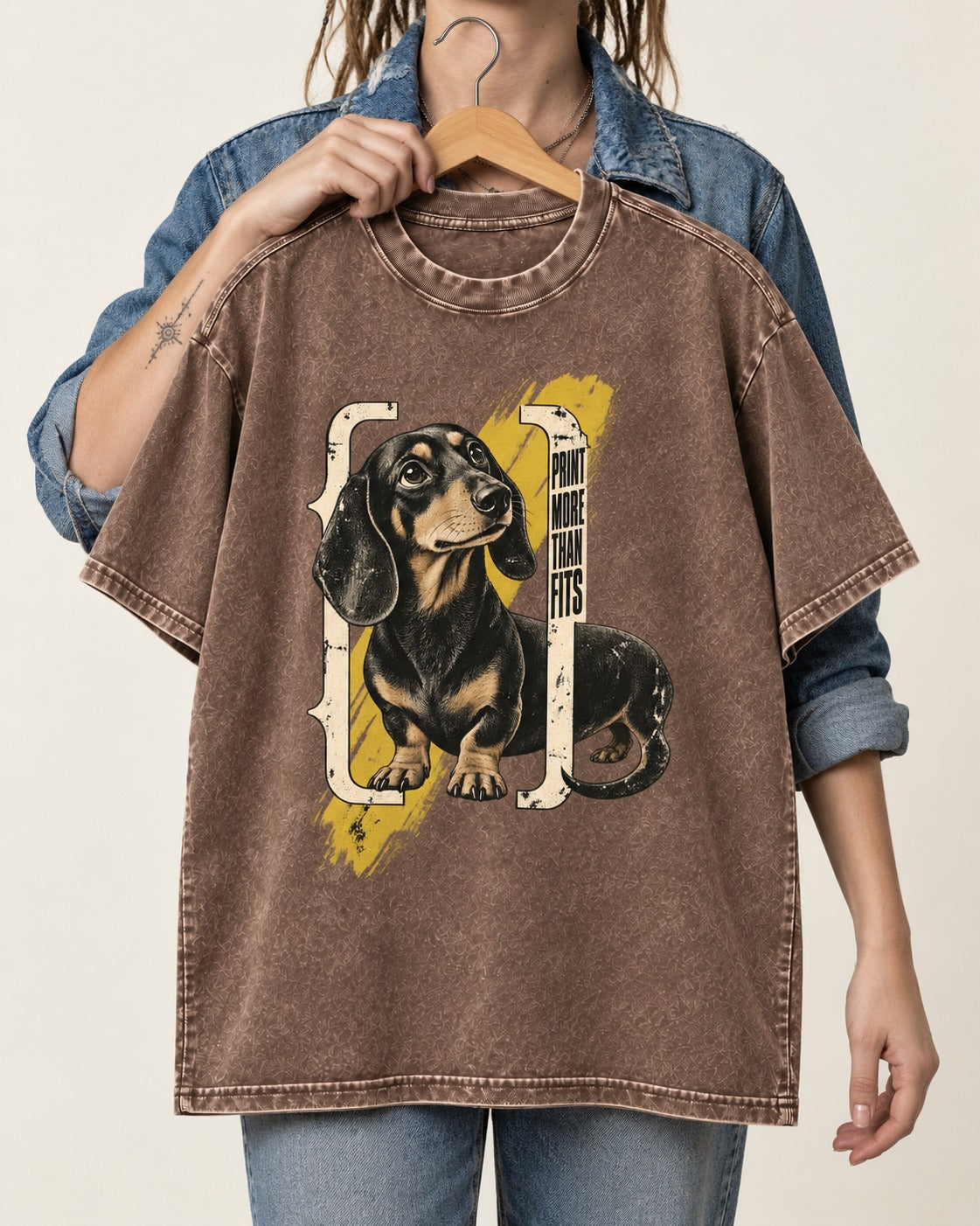Dachshund More Than Fits Washed Tee in Coffee, held up on a hanger