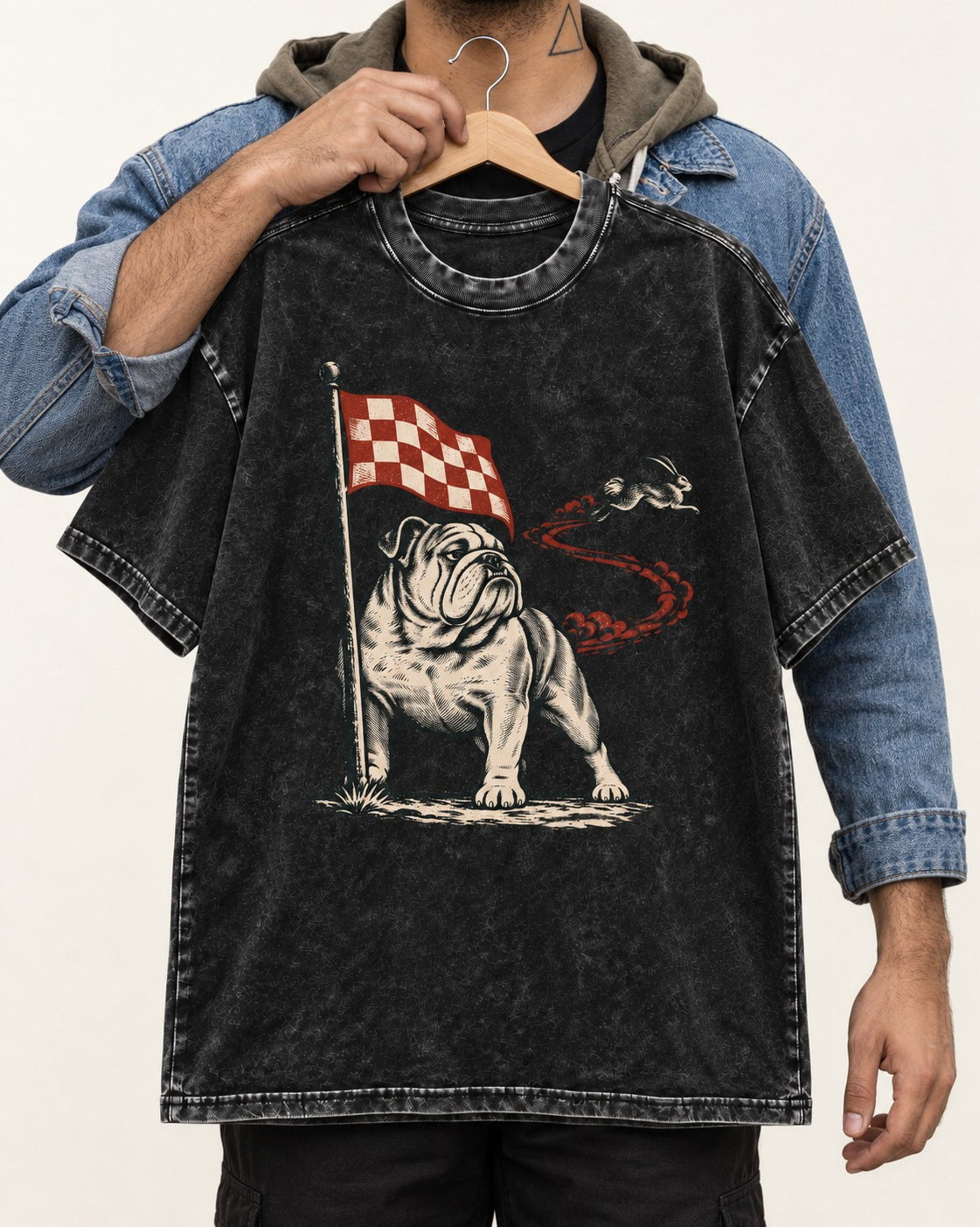English Bulldog Checkered Flag Rabbit Chase Washed Tee in Black, held up on a hanger